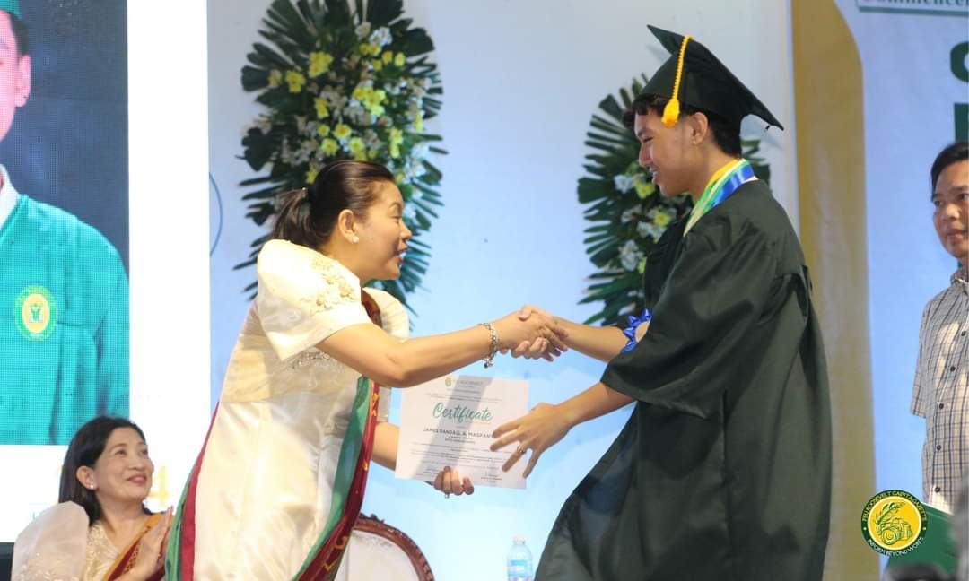 Receiving the diploma